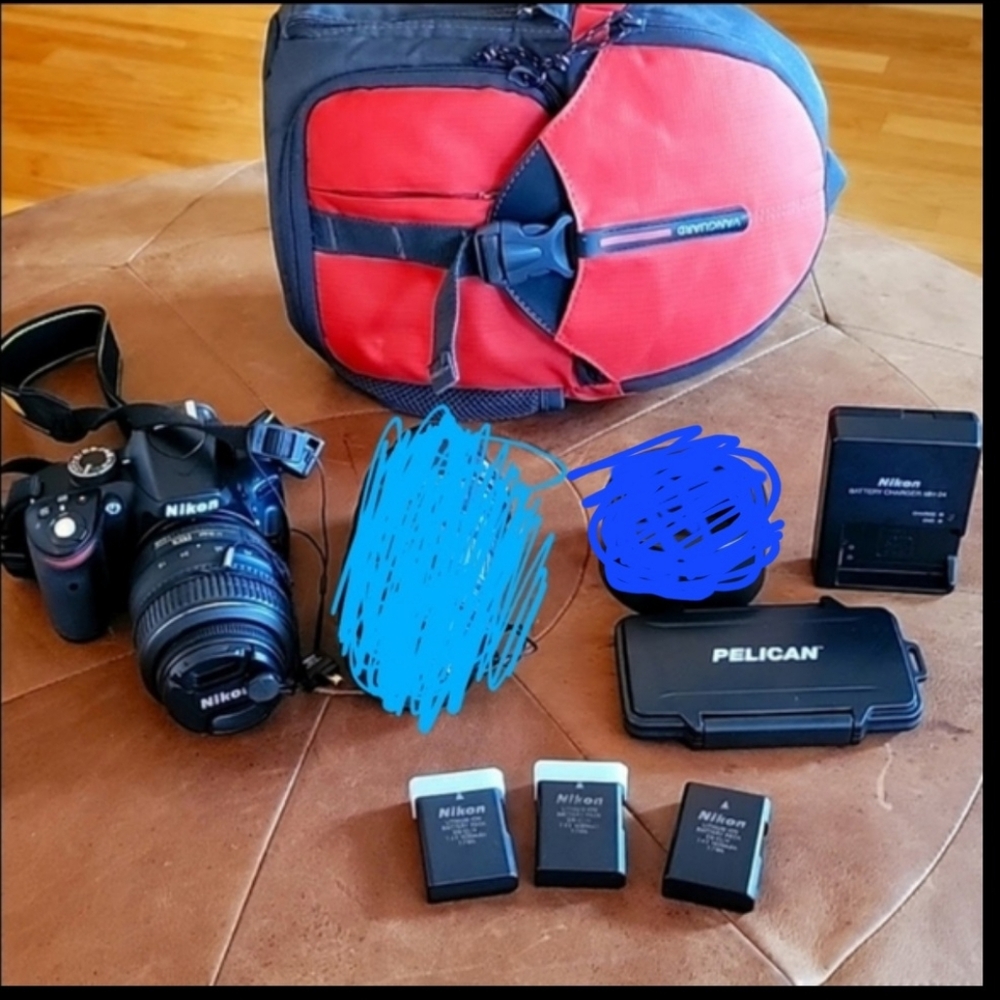 Nikon D3200 camera and 18-55 wide angle lense, and other extras